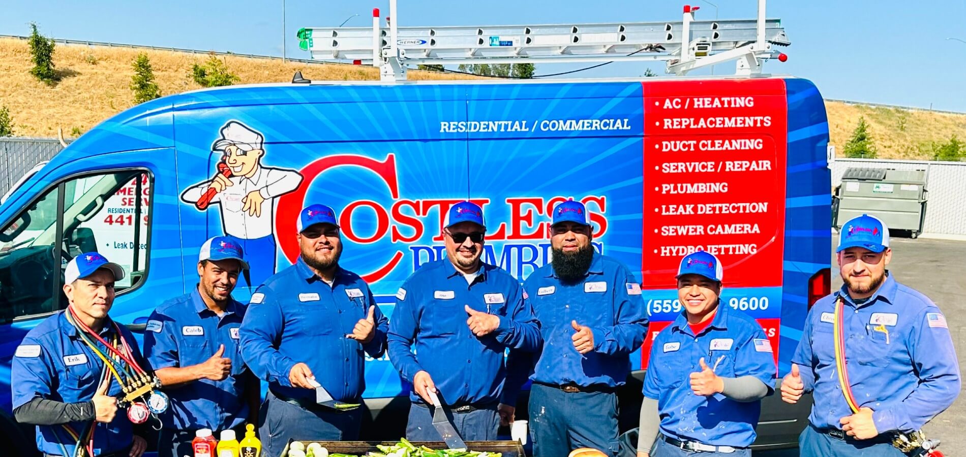 Costless Plumbing workers in a group